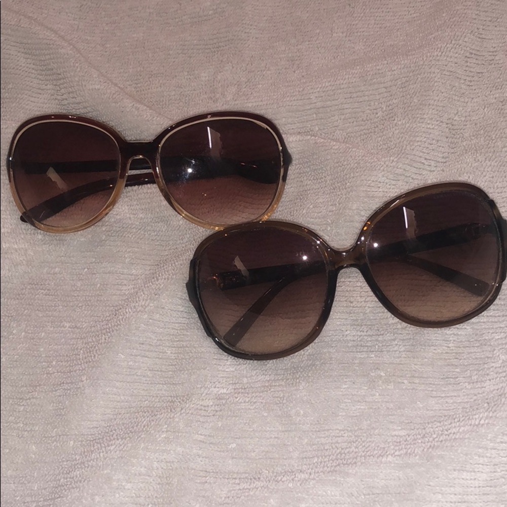 2 pairs of brown sunglasses
